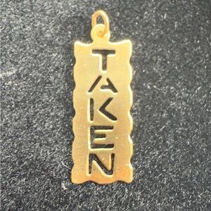 Gold 'TAKEN' Pendant